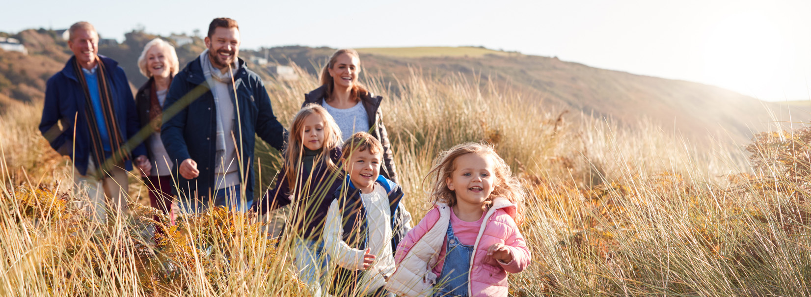 family walking by the beach